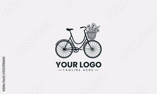 A vintage bicycle with a floral basket is illustrated in minimalist black vector logo design