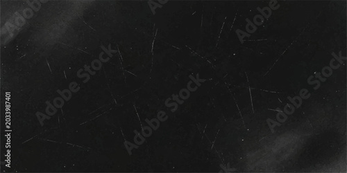 Foto A close-up view of a dusty blackboard covered in faint white chalk marks and scratch lines, hinting at past lessons and creative expression