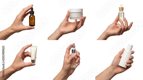 Fotografía Various hands holding a collection of skincare and cosmetic product containers, beauty essentials isolated