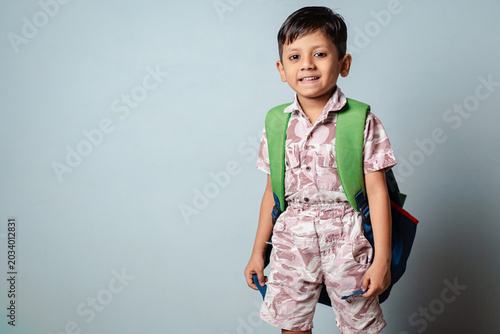 Smiling Indian Schoolboy with Backpack Ready for Back to School