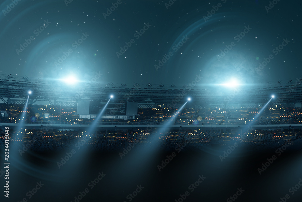 Naklejka premium Dramatic night view of a sports stadium illuminated by powerful floodlights and bright light beams, creating an intense atmosphere for a professional game or championship event