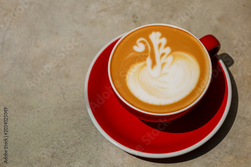 Red cup holds creamy latte art