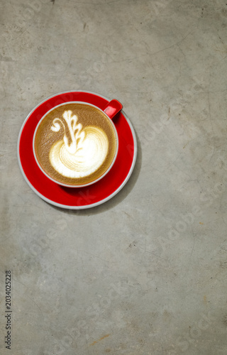 Red cup holds creamy latte art