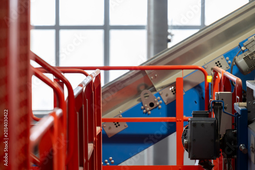 Photos Industrial conveyor structure inside automated recycling facility