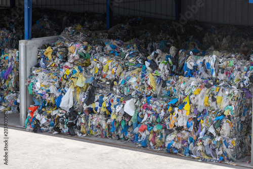 Принти на полотні Bales of compressed plastic waste stored at recycling facility