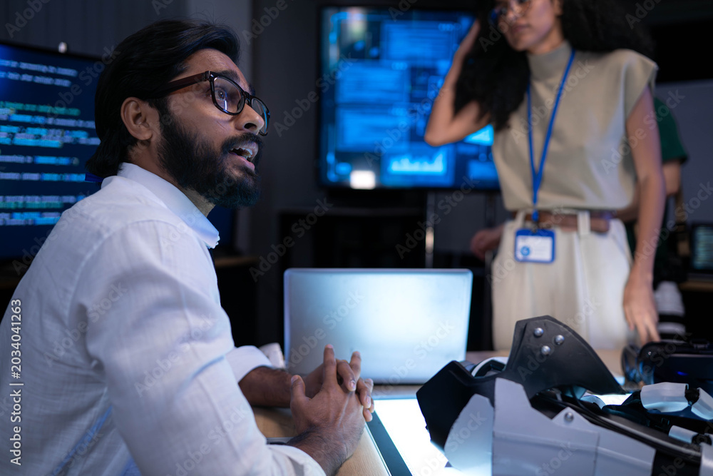 Fototapeta premium Software engineer discussing advanced virtual reality technology and digital product development