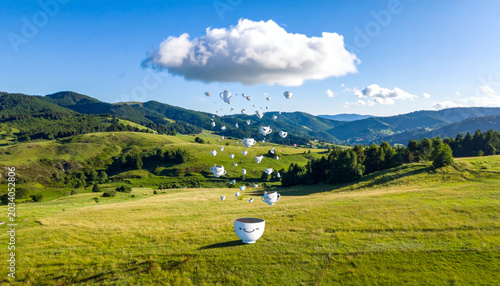 A whimsical cloud showers tiny giggling teacups over a lush green meadow under a bright blue sky