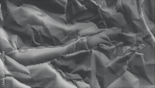 Fotografie Crinkled gray paper texture fills the entire frame with deep folds