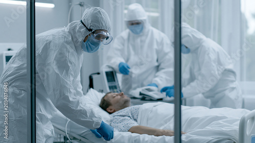 Medical Team in Hazmat Suit...