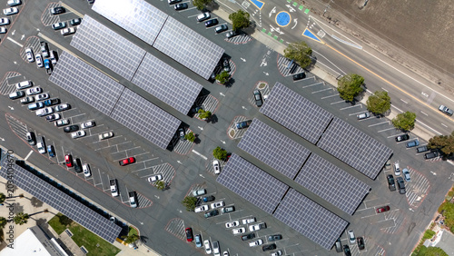 Obraz na płótnie Angled drone view of solar panel carports over a large parking lot