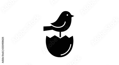 Minimalist black silhouette of a bird hatching from an egg against a white background