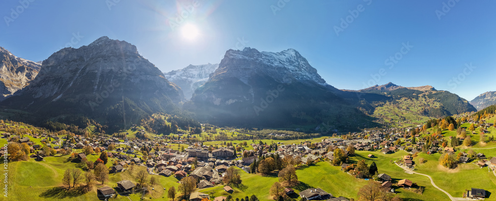 Obraz premium Switzerland Autumn landscape of Grindelwald village aerial panorama with Eiger mountain peak in background. Grindelwald, Bern, Switzerland.