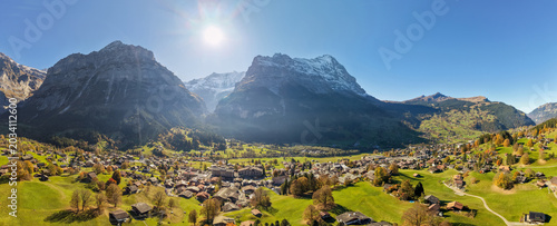 Switzerland Autumn landscape of Grindelwald village aerial panorama with Eiger mountain peak in background. Grindelwald, Bern, Switzerland.
