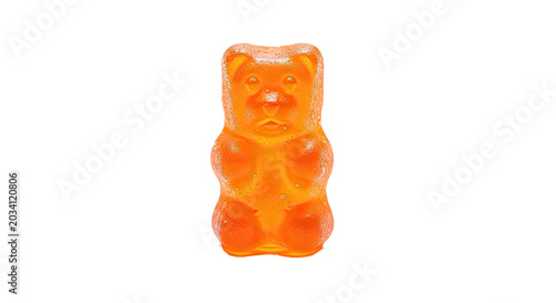 Bright orange gummy bear candy isolated on transparent background in playful 3D style