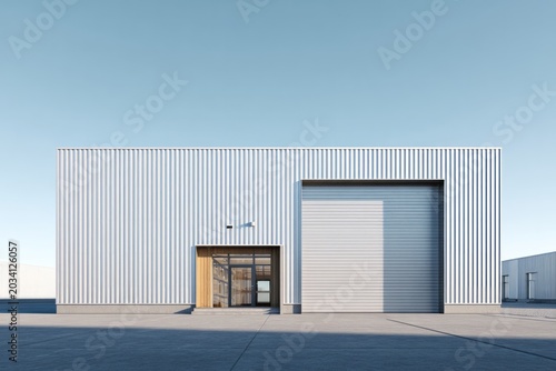 Modern corrugated metal building with large roll-up door and entrance.
