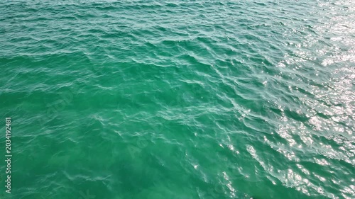 Top Angle View of Sunlit Turquoise Ocean Water Surface