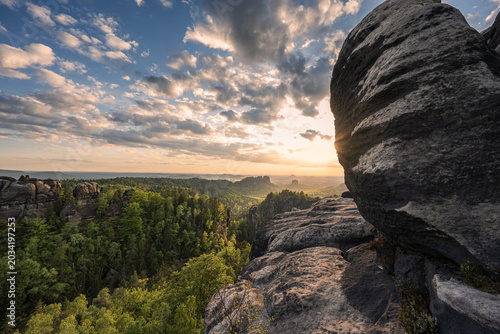 Schilderij op canvas Beautiful sunrise over Saxon Switzerland national park with sandstone rocks and green forests