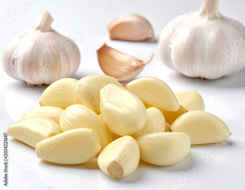 Fresh, peeled garlic cloves with whole bulbs