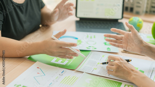The business team is discussing ESG concepts and sustainability in the office.
Professional colleagues are planning a green business strategy using ESG investment criteria.
(Close-up view)