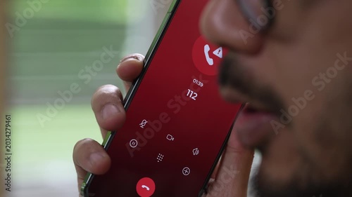 Man calling emergency number 112 for crisis situation