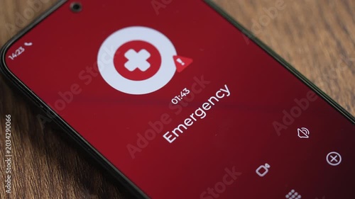 Close-up smartphone showing Emergency calling number on the screen