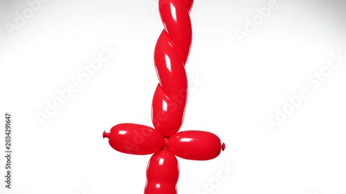 Red twisted balloon animal with a flower-shaped base, against a plain white backdrop for a party theme