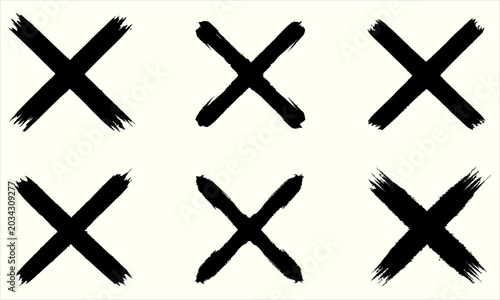 Tableau sur toile Six black brush stroke crosses against a light background in a grid pattern