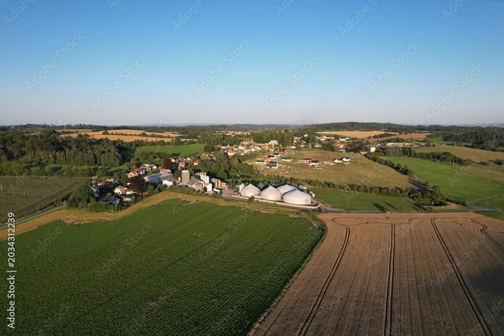 Naklejka premium biogas production, biogas plants, bioenergy,aerial panorama landscape view of bio gas production facility and powerplant,European energy crisis,green renewable energy in Europe