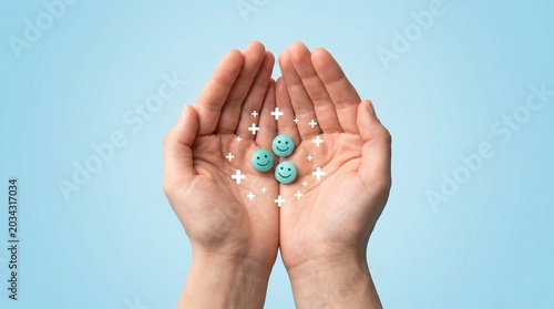 Cupped hands holding blue smiley face pills, mental health and antidepressant medication concept, pharmaceutical wellness and emotional support