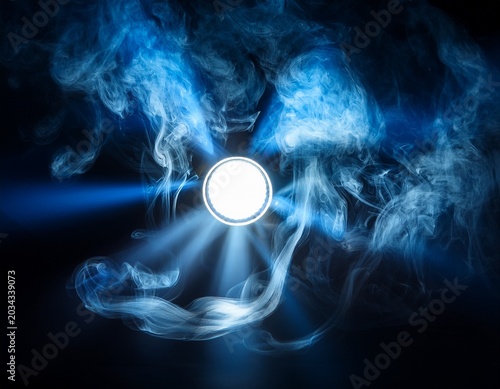 a dramatic spotlight illuminating swirling smoke in a dark moody atmosphere with blue tones