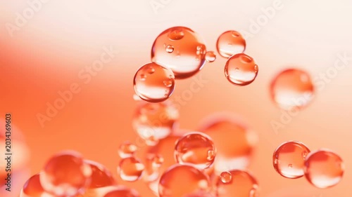 Floating Orange Bubbles In Gentle Motion. Closeup Of Shimmering Liquid Bubbles Over Warm Background