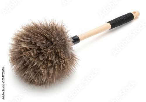 A dusting brush with accumulated dust and small debris on its bristles