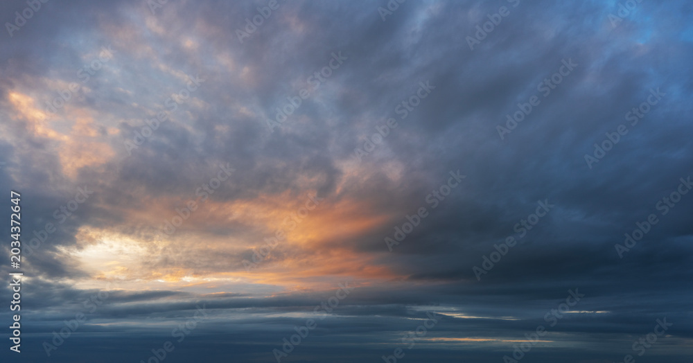 Fototapeta premium Clouds at sunset on the sky.