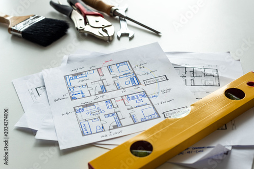 Konstfotografi Architectural plans with construction tools.