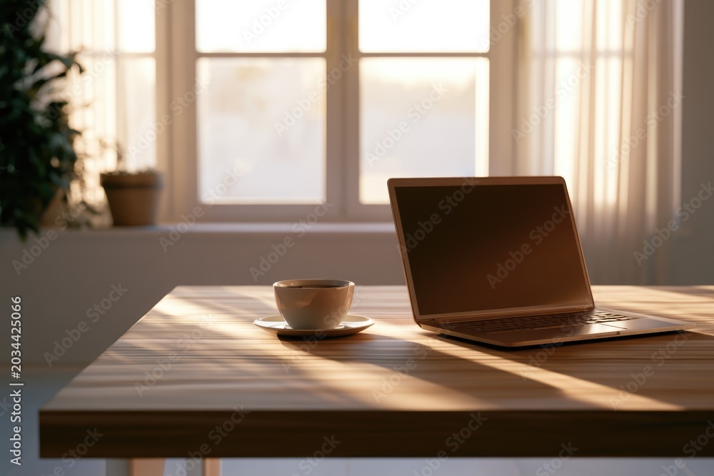 Fototapeta premium Minimal Home Office Workspace with Laptop and Coffee Cup in Morning Sunlight