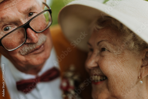 Photography Senior couple having marriage in nature during spring day.
