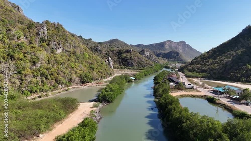 Aerial Drone View Of Coastal Fishing Village Thailand
Aerial drone footage of coastal fishing village near Thung Sam Roi Yot with mountains and boats in Thailand on 19 May 2026.
