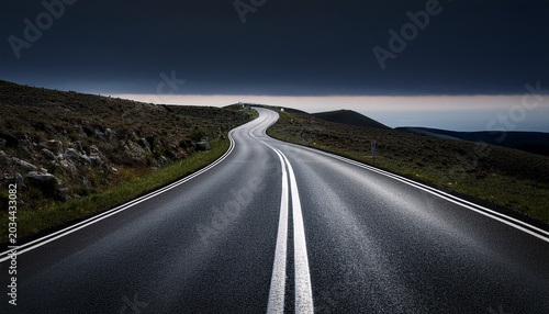 Winding Two Lane Road Against A Dark Background