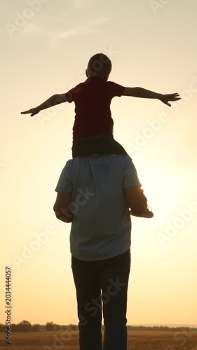silhouette father carrying child boy his shoulders sunsethappy family, father carrying child, child on shoulders, sunset family time, parent child bonding, outdoor family fun, silhouette father son