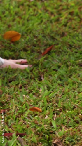 Bare feet of two women walking on grass nature wellness concept