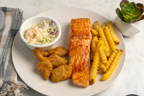 Valokuva barbecue salmon with breaded shrimp  , french fries and cole slaw