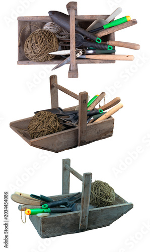 Wooden box with gardening tools on an isolated background.