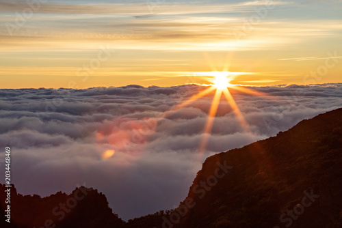 Breathtaking sunrise at Pico de Arieiro over the clouds in Madeira
