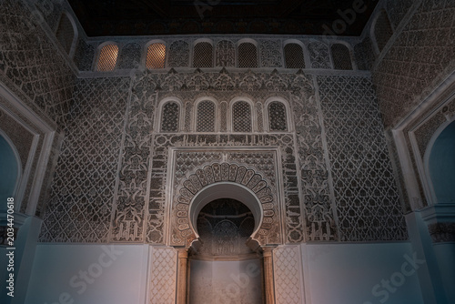 Traditional Moroccan geometric patterns and Islamic ornament details creating luxurious abstract architectural background textures.