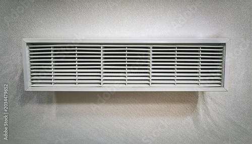white steel wall mounted ventilation grid designed to remove heat and odors