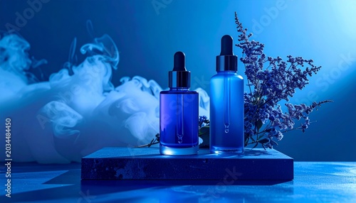 Two Blue Skincare Serum Bottles on Textured Platform in Studio Lighting