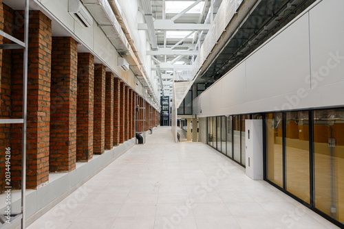 Spacious Corporate Hallway With Brick Columns