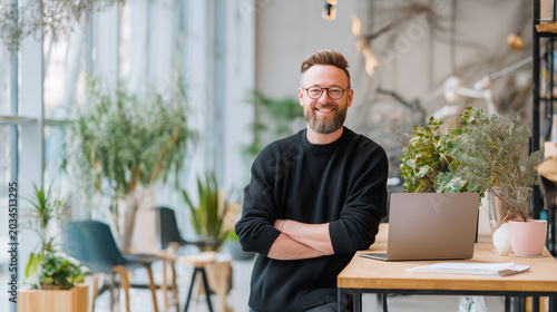 Candid recruitment office portrait of smiling businessman in modern coworking environment