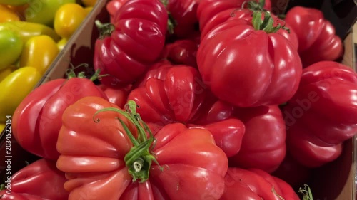Abundant Ripe Red Heirloom Cultivar Tomatoes Arranged At Farmers Market Stand