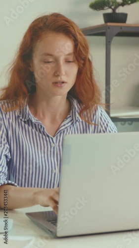 Person in distress seeks medical aid urgently, Caucasian redhead experiences discomfort and appears very concerned